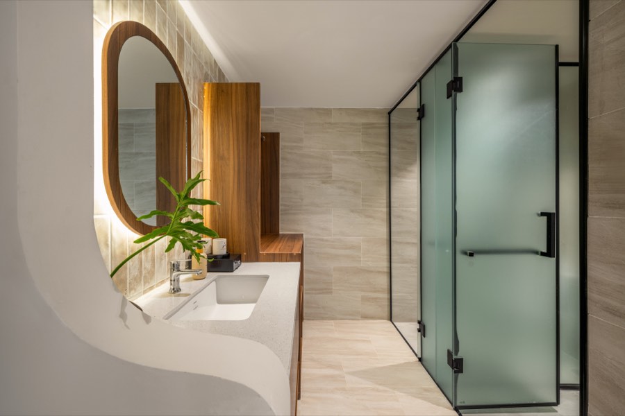 The vanity and the glass shower enclosure — bathroom at Fuka House, Da Nang