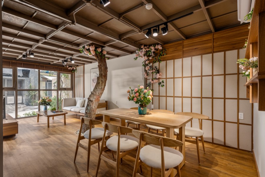 The dining room set beneath the timber ceiling