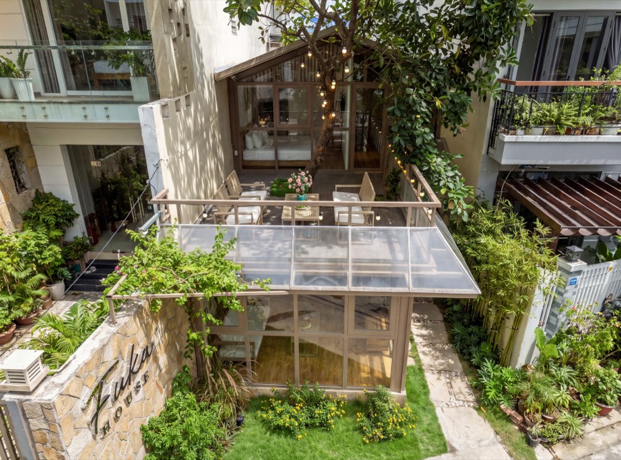 Looking down over the terrace and the pitched glass roof — exterior at Fuka House, Da Nang